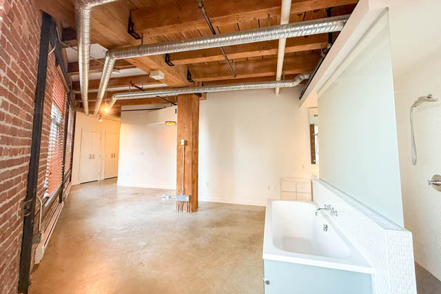 Spacious loft with exposed brick walls, polished concrete floors, and modern fixtures. - 221 - 55 E. Cordova, Vancouver Downtown