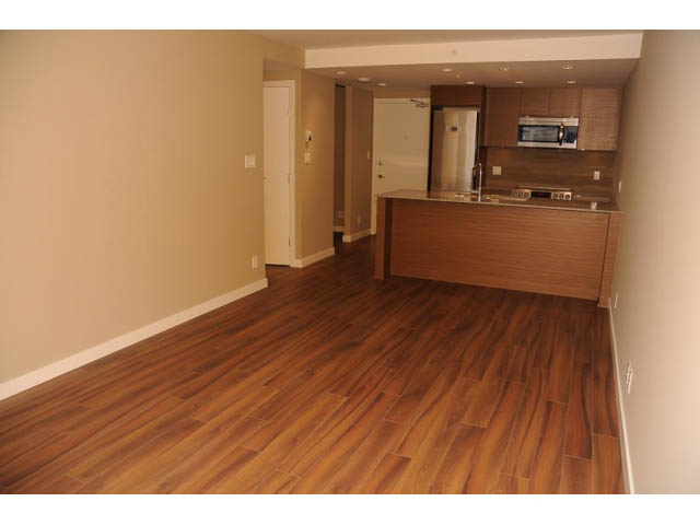 Bright kitchen with hardwood floors and modern cabinetry. - 310 - 135 East 17th Street, North Vancouver