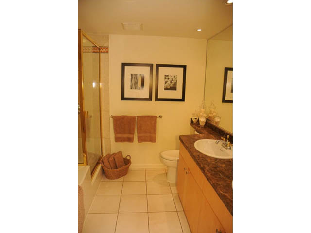 Spacious bathroom with granite countertops and a walk-in shower. - 121 -1228 Marinaside Crescent, Vancouver Downtown