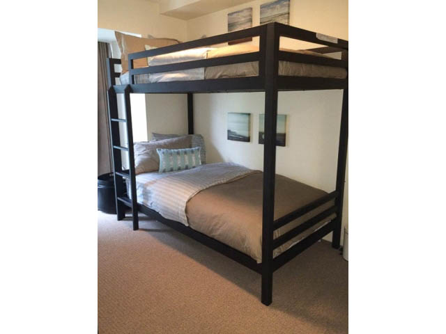 Bright loft bedroom with modern bunk bed, cozy bedding, and city view. - 121 -1228 Marinaside Crescent, Vancouver Downtown