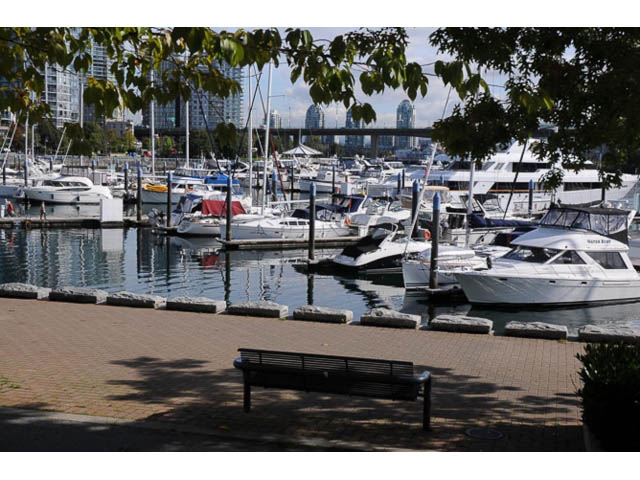 Furnished townhouse with a serene marina view, docked boats and city skyline in the background. - 121 -1228 Marinaside Crescent, Vancouver Downtown