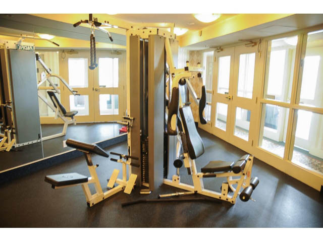 Bright and spacious gym with various workout equipment and large windows. - 121 -1228 Marinaside Crescent, Vancouver Downtown