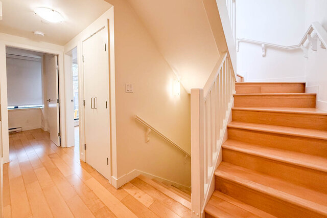 Bright entryway leading to a cozy den with hardwood floors and a staircase. - 3238 Tupper Street, Vancouver West Side