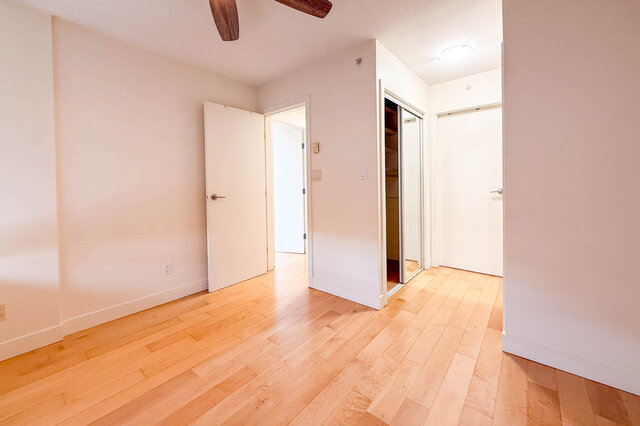 Spacious living room with hardwood floors and sliding closet doors. - 3238 Tupper Street, Vancouver West Side