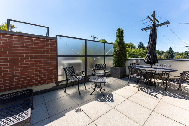 Spacious rooftop patio with modern furniture, privacy glass, and city views. - 3238 Tupper Street, Vancouver West Side