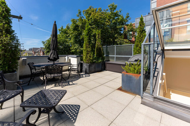 Spacious rooftop patio with outdoor furniture, potted plants, and a clear blue sky. - 3238 Tupper Street, Vancouver West Side