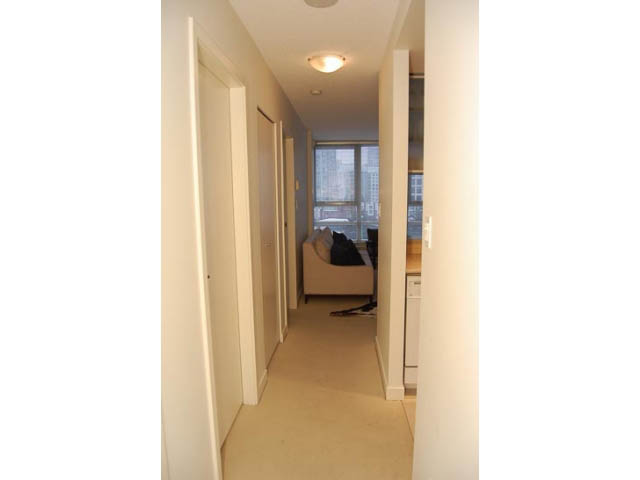 Furnished hallway leading to a cozy bedroom with city view. - 911 - 939 Expo Boulevard, Vancouver Downtown