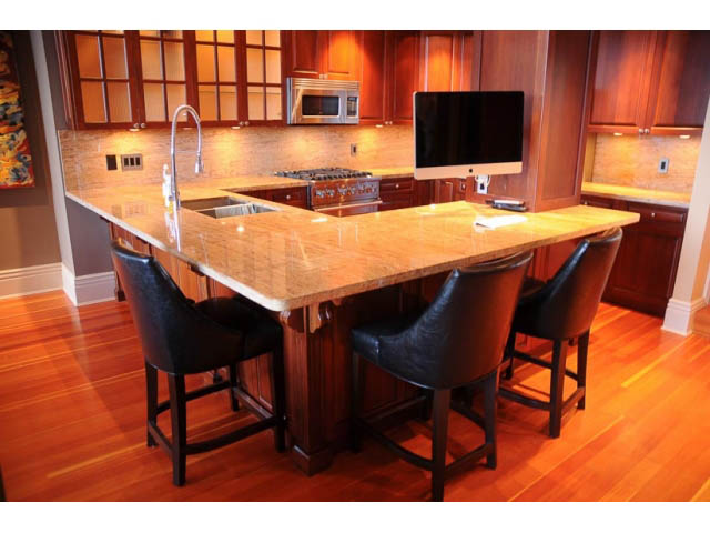 Bright kitchen with granite countertops, hardwood floors, and a modern island setup. - 654 Millbank, Vancouver West Side