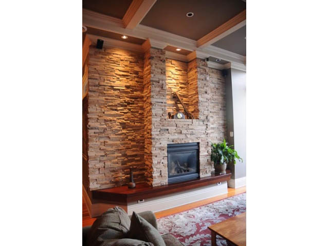 Spacious living room with stone fireplace and coffered ceiling. - 654 Millbank, Vancouver West Side