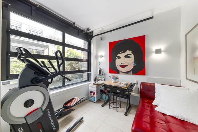 Bright living room with red leather couch, large window, and pop art wall decor. - 302 - 1241 Homer Street, Vancouver Downtown
