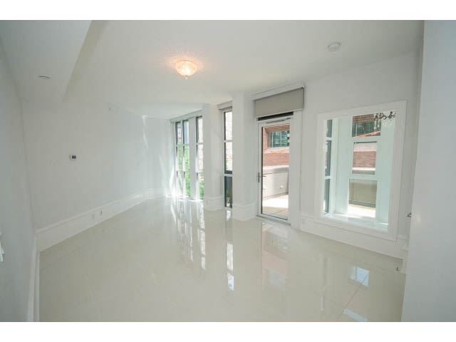 Bright living room with glossy white floors and large windows. - 403 - 1102 Hornby St
403 - 1102 Hornby Street, Vancouver Downtown