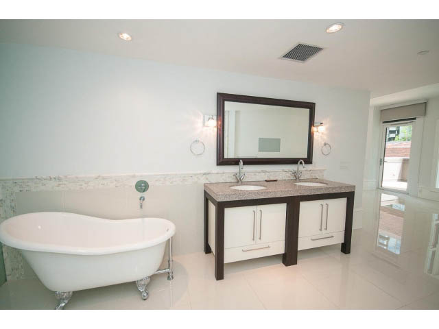 Spacious bathroom with white clawfoot tub, granite countertops, and large mirror. - 403 - 1102 Hornby St
403 - 1102 Hornby Street, Vancouver Downtown