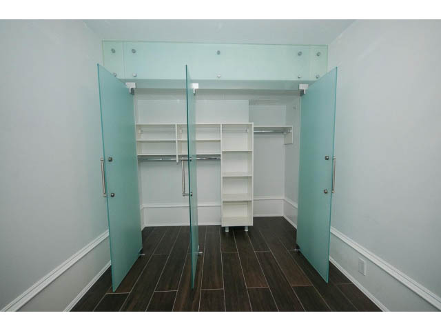 Spacious walk-in closet with frosted glass doors and built-in shelves. - 403 - 1102 Hornby St
403 - 1102 Hornby Street, Vancouver Downtown