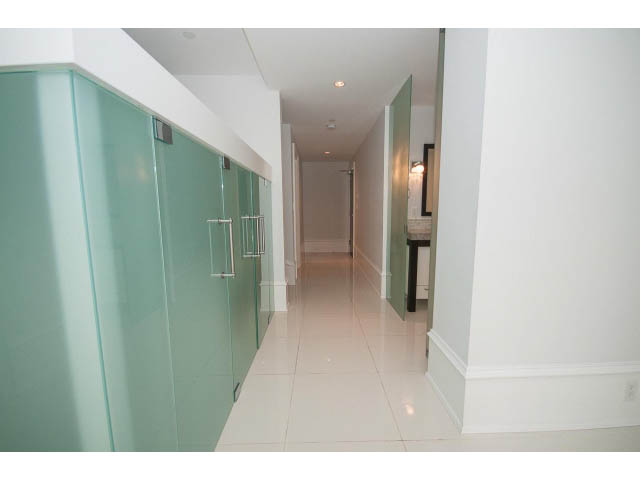 Bright hallway with glossy teal doors and white tiled floors. - 403 - 1102 Hornby St
403 - 1102 Hornby Street, Vancouver Downtown
