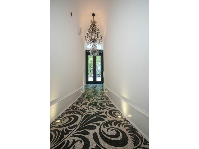 Foyer with elegant chandelier and patterned carpet leading to entrance. - 403 - 1102 Hornby St
403 - 1102 Hornby Street, Vancouver Downtown