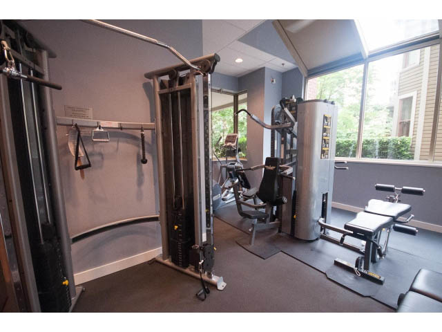 Fitness room with exercise equipment and large windows. - 1404 - 819 Hamilton Street, Vancouver Downtown