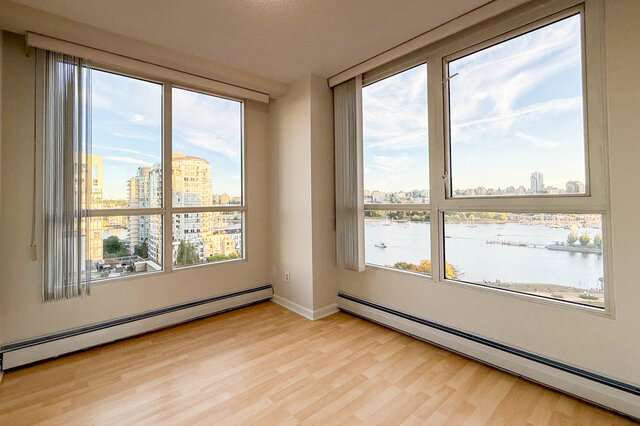 The corner bedroom's two walls of windows over False Creek and the boats - 15B-199 Drake Street, Vancouver Downtown