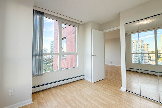 The corner bedroom's window over the park, with a mirrored closet - 15B-199 Drake Street, Vancouver Downtown