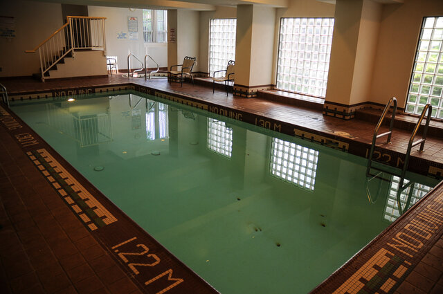 The indoor pool with the hot tub behind it and glass block windows - 15B-199 Drake Street, Vancouver Downtown