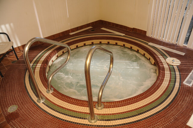 The building's indoor hot tub ringed in mosaic tile - 15B-199 Drake Street, Vancouver Downtown
