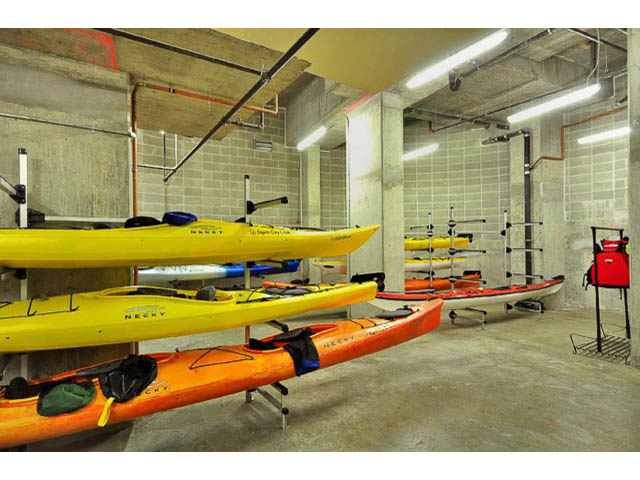 Storage room with kayak racks and concrete walls. - 2203 - 33 Smithe Mews, Vancouver Downtown