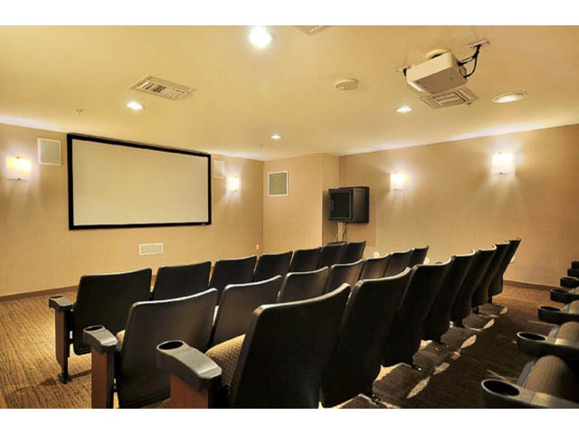 Bright movie theater with rows of seats and a large screen, perfect for private screenings. - 2203 - 33 Smithe Mews, Vancouver Downtown