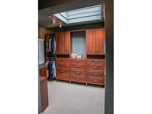 Spacious walk-in closet with built-in cabinets and skylight. - 4541 Strathcona Road, North Vancouver