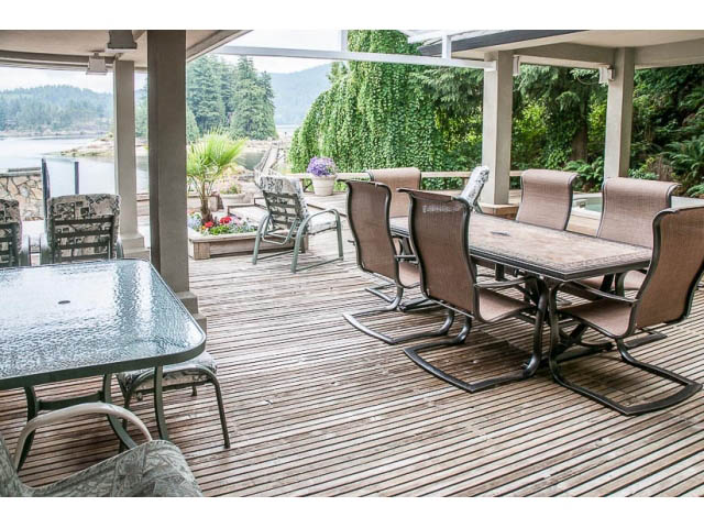 Furnished patio with outdoor seating and a view of the water. - 4541 Strathcona Road, North Vancouver