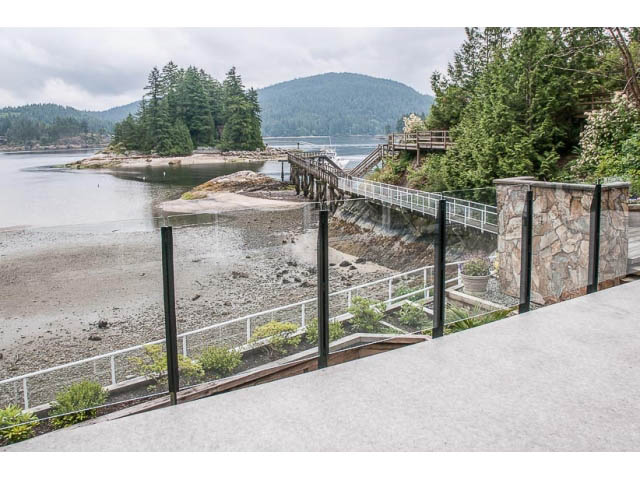 Furnished living room with a view of the water and mountains. - 4541 Strathcona Road, North Vancouver