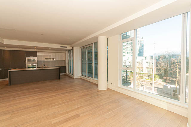 Bright kitchen with hardwood floors, city view, and modern furnishings. - 202 - 1409 W Pender St, Vancouver Downtown