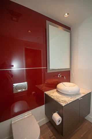 Bathroom with red glossy wall, marble countertop, and modern sink. - 202 - 1409 W Pender St, Vancouver Downtown