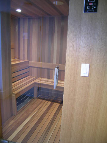 Furnished 1-bedroom + den with wooden paneling and built-in shelving. - 202 - 1409 W Pender St, Vancouver Downtown