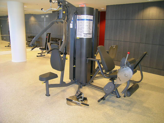 Fitness room with weight machines and cardio equipment. - 202 - 1409 W Pender St, Vancouver Downtown