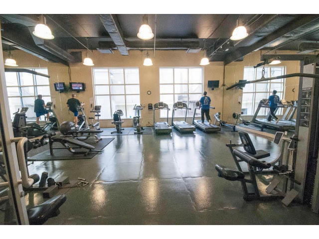 Furnished gym with treadmills and large windows, city view. - 2201 - 938 Smithe Street, Vancouver Downtown