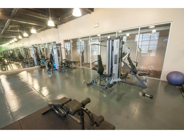 Spacious gym with cardio equipment and mirrors, modern design. - 2201 - 938 Smithe Street, Vancouver Downtown