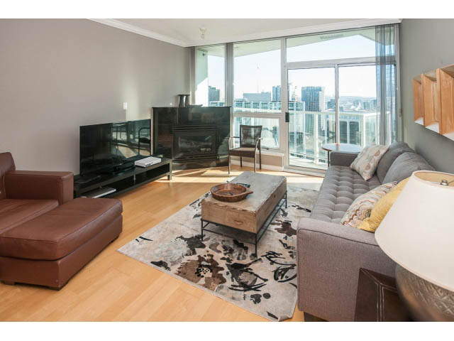 Furnished living room with hardwood floors, city view, and modern decor. - 3602 - 1111 W Pender, Vancouver Downtown