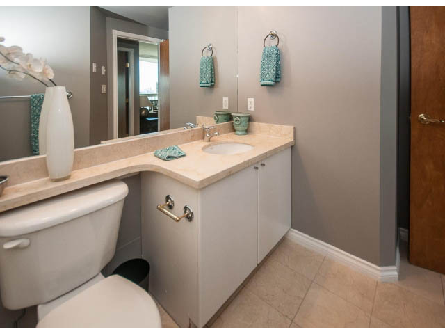 Bright bathroom with beige countertops and a modern sink setup. - 3602 - 1111 W Pender, Vancouver Downtown