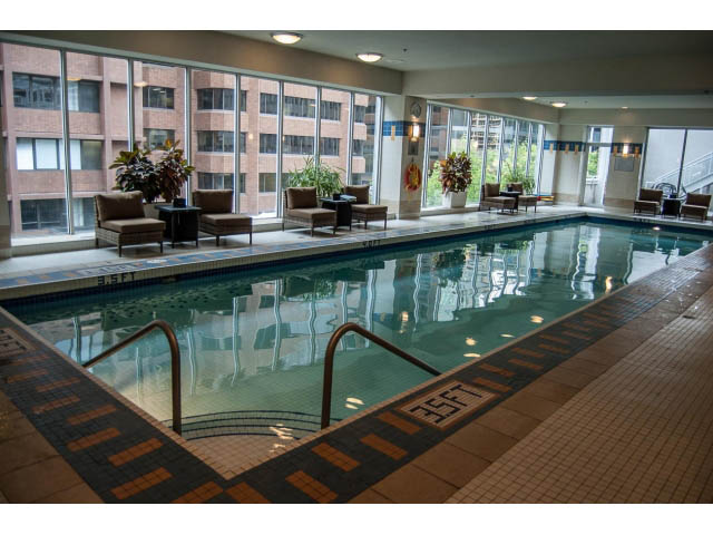 Spacious living room with large windows, city view, and comfortable seating. - 3602 - 1111 W Pender, Vancouver Downtown