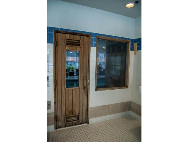 Furnished 1-bedroom with wooden door and window, tiled floor, and city view. - 3602 - 1111 W Pender, Vancouver Downtown