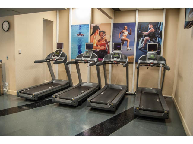 Bright gym with treadmills and motivational posters. - 3602 - 1111 W Pender, Vancouver Downtown