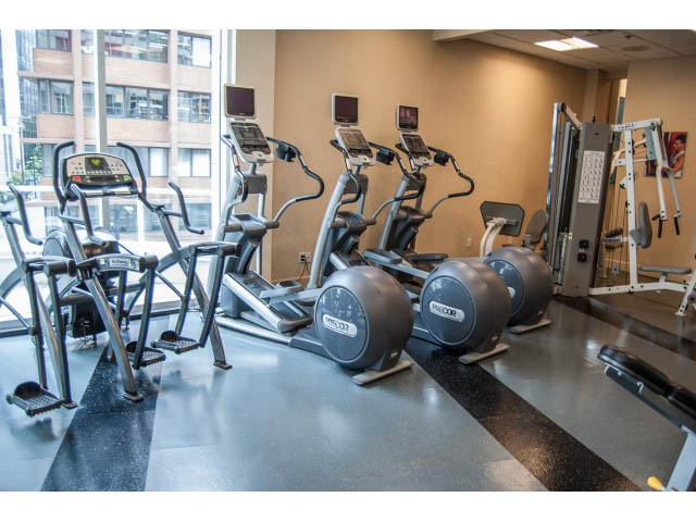 Bright gym with cardio equipment and city view. - 3602 - 1111 W Pender, Vancouver Downtown