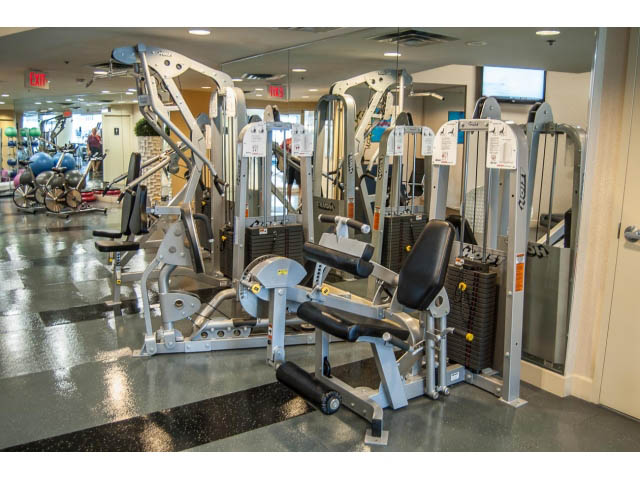 Fitness room with cardio and strength machines, shiny floor. - 3602 - 1111 W Pender, Vancouver Downtown