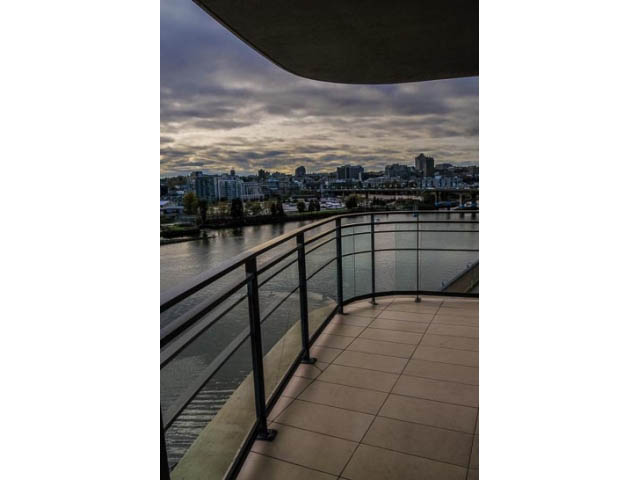 Bright balcony with city view and modern railings. - 900 - 9 Smithe Mews, Vancouver Downtown