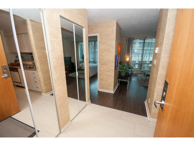 Furnished 1-bedroom with hardwood floors, city view, and modern decor. - 507 - 1200 West Georgia Street, Vancouver Downtown
