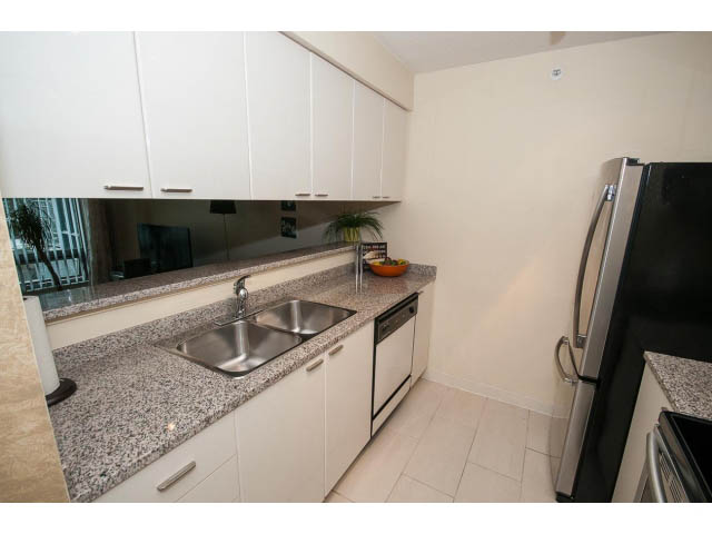Bright kitchen with granite countertops and stainless steel appliances, featuring a city view. - 507 - 1200 West Georgia Street, Vancouver Downtown