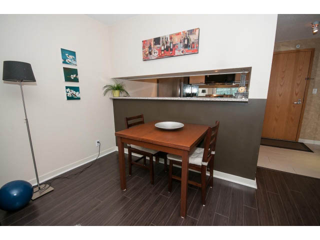 Bright dining area with hardwood floors and modern decor. - 507 - 1200 West Georgia Street, Vancouver Downtown
