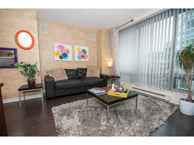 Spacious living room with city view, modern furniture, and plush rug. - 507 - 1200 West Georgia Street, Vancouver Downtown