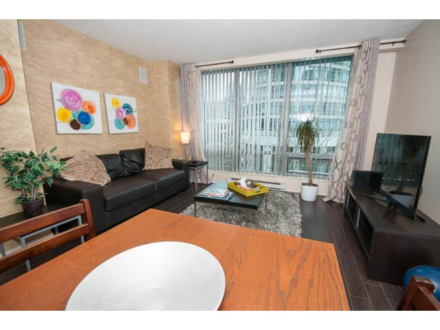 Furnished living room with hardwood floors, city view, and modern decor. - 507 - 1200 West Georgia Street, Vancouver Downtown