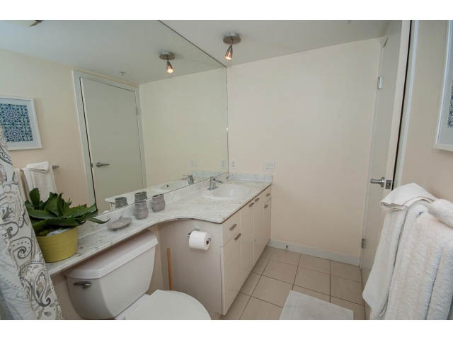 Bright bathroom with white countertop and towel rack. - 507 - 1200 West Georgia Street, Vancouver Downtown