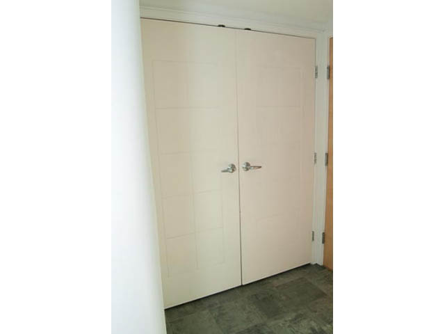 Bright hallway with white double doors and dark tiled floor. - 1406 - 1003 Burnaby Street, Vancouver Downtown